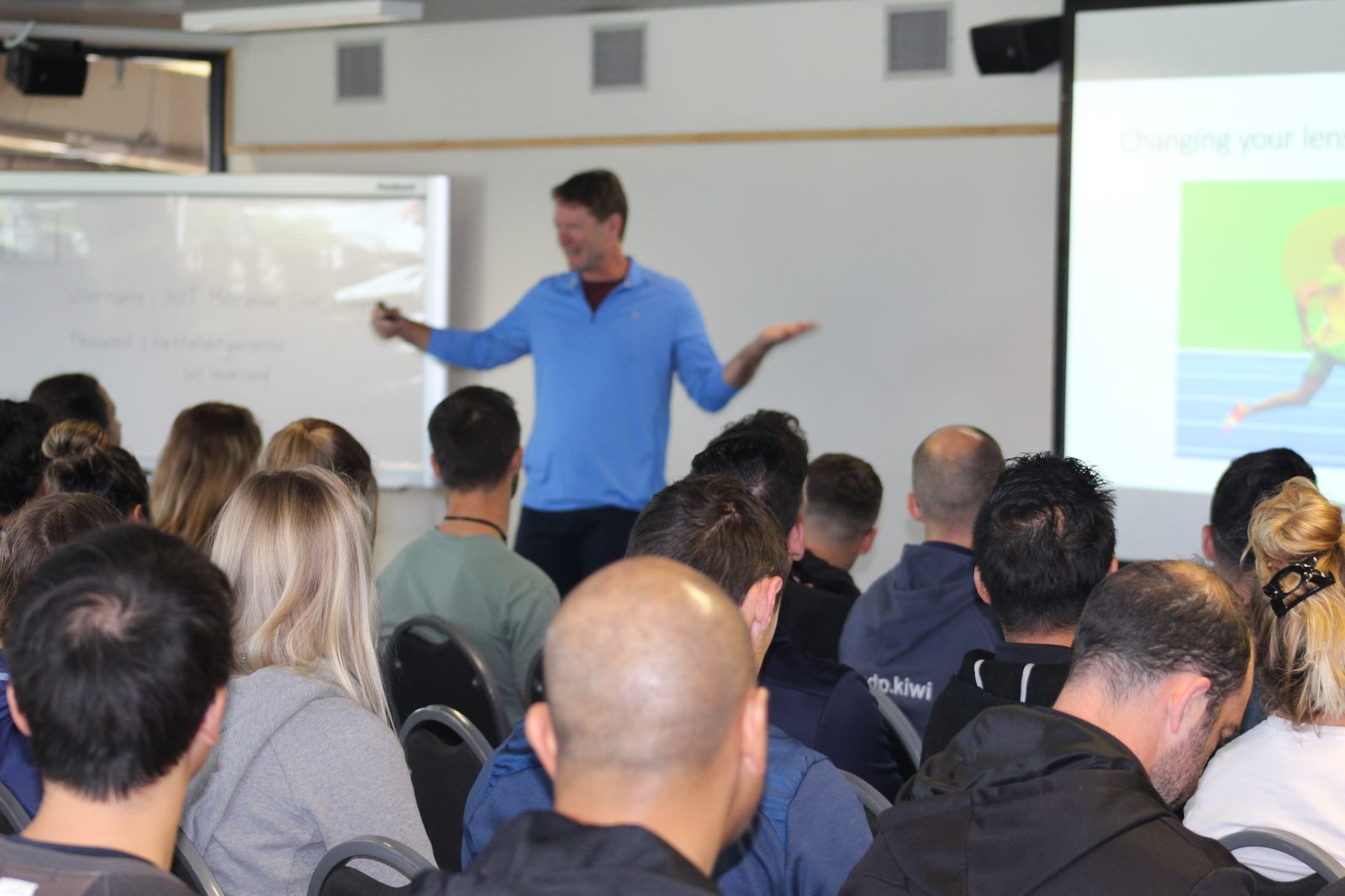 Chris Korfist speaking to a room of coaches at a training clinic
