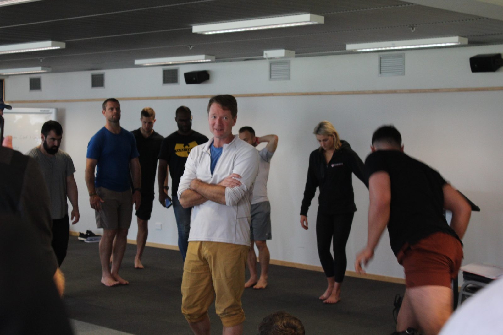 Chris Korfist leading a group training session indoors